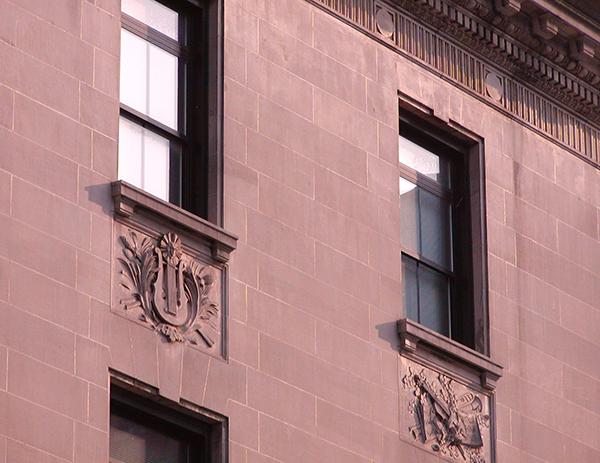 stone friezes on side of building